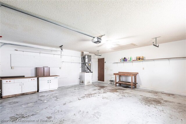 1811 Jackson Dr, Sebring, FL 33870 - garage featuring heating unit, a garage door opener, and a ceiling fan
