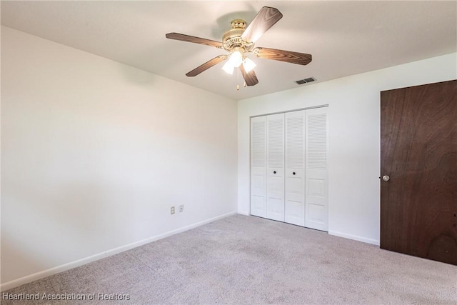 1811 Jackson Dr, Sebring, FL 33870 - unfurnished bedroom with a closet, visible vents, baseboards, a ceiling fan, and carpet floors