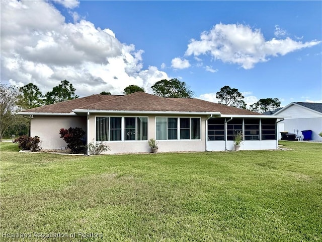 ranch-style home with a front yard and a sunroom