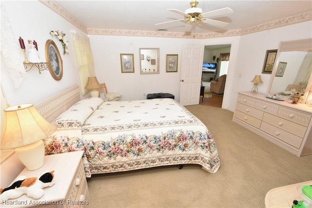 carpeted bedroom with ceiling fan