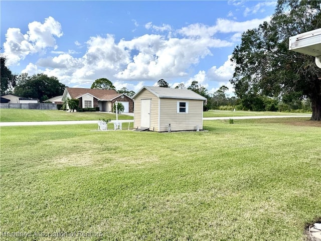 view of side of home featuring a storage unit and a lawn