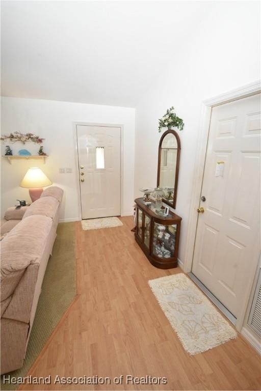 foyer entrance with light hardwood / wood-style flooring