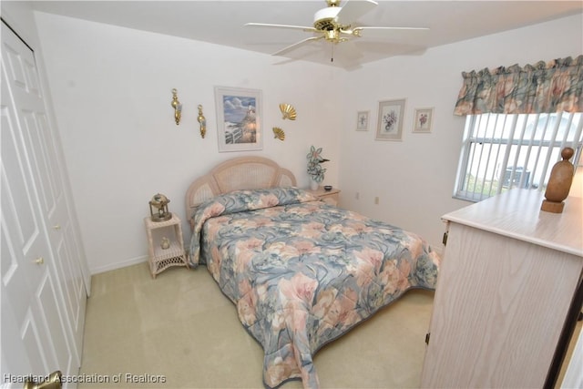 carpeted bedroom featuring ceiling fan