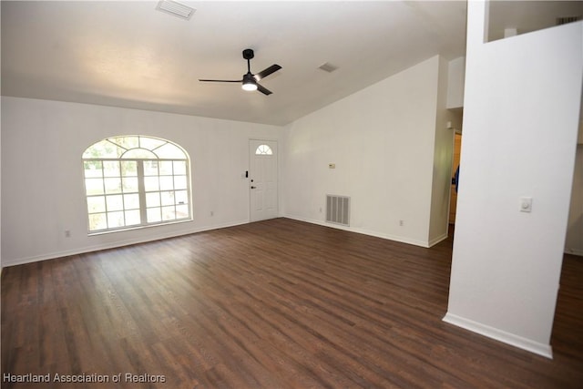 1922 N Torrington Rd, Avon Park, FL 33825 - unfurnished living room featuring ceiling fan, dark wood-style flooring, and vaulted ceiling