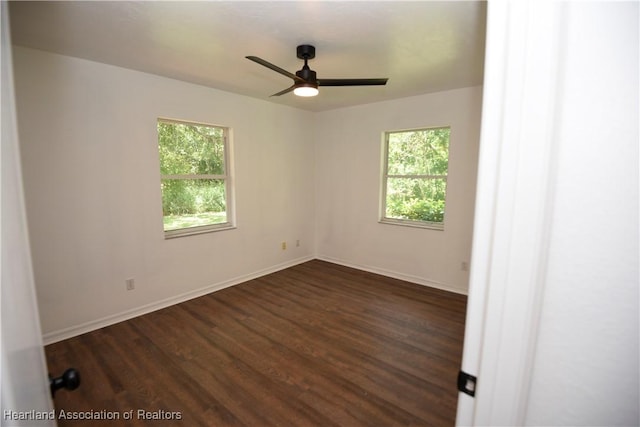 1922 N Torrington Rd, Avon Park, FL 33825 - spare room featuring plenty of natural light, a ceiling fan, and dark wood-style floors