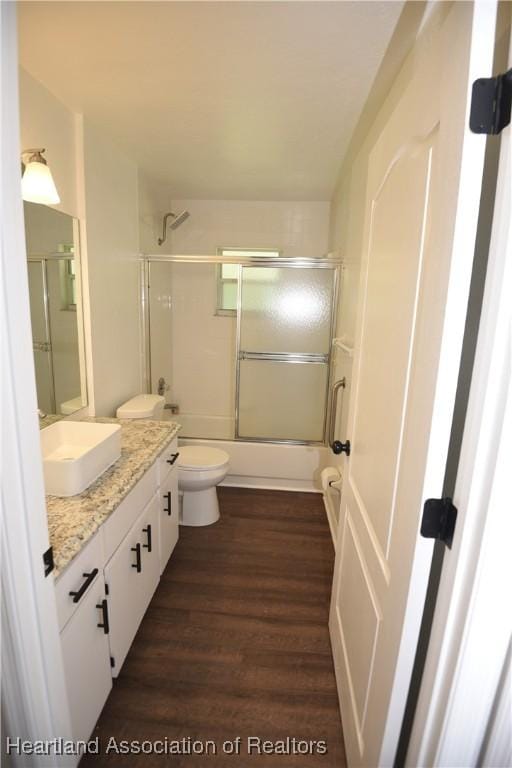 1922 N Torrington Rd, Avon Park, FL 33825 - full bath featuring vanity, enclosed tub / shower combo, and wood finished floors