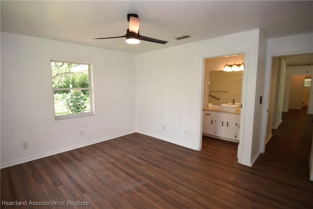 1922 N Torrington Rd, Avon Park, FL 33825 - unfurnished bedroom with dark wood-style floors, ensuite bath, and a ceiling fan