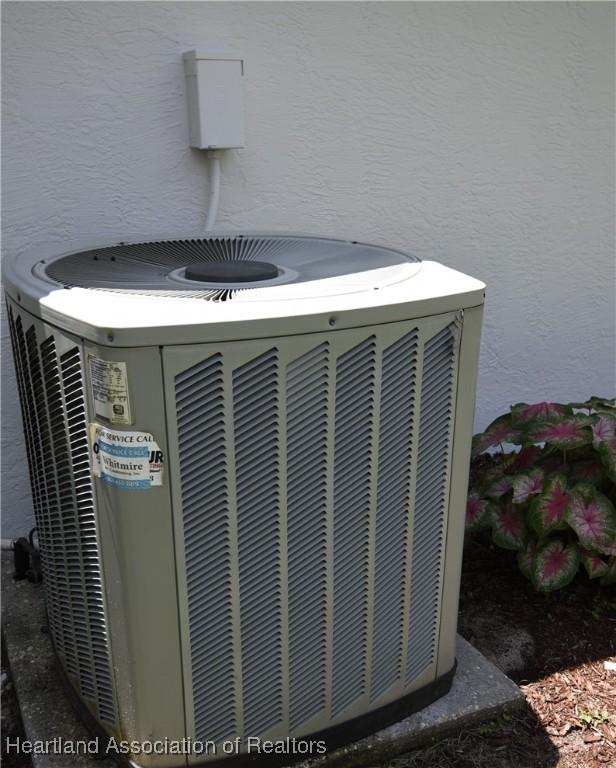 1922 N Torrington Rd, Avon Park, FL 33825 - exterior view of a central AC unit and stucco siding
