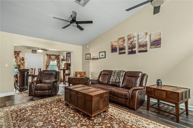 living room featuring ceiling fan, vaulted ceiling, and hardwood / wood-style flooring