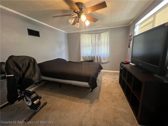 bedroom with ceiling fan, light colored carpet, and crown molding