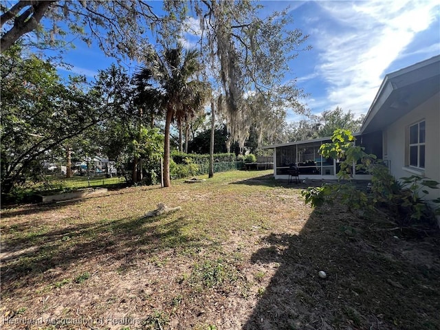 view of yard with a sunroom