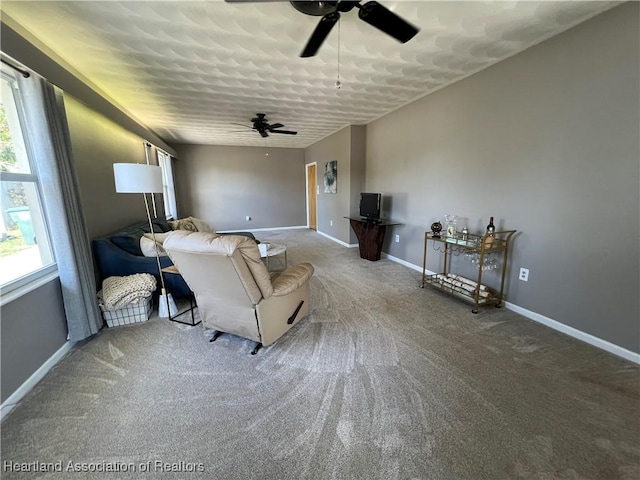 living room with carpet flooring and ceiling fan