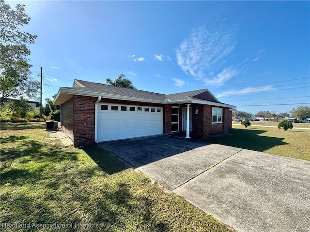 single story home featuring a front yard, a garage, and central air condition unit