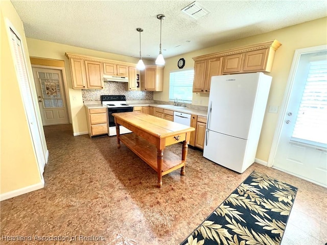 kitchen featuring pendant lighting, a textured ceiling, white appliances, decorative backsplash, and light brown cabinetry