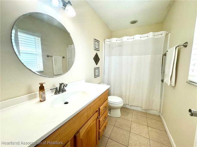 full bathroom featuring vanity, tile patterned floors, shower / bath combination with curtain, toilet, and a textured ceiling