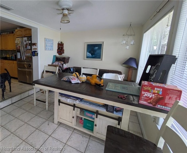 2068 Oak Blvd, Sebring, FL 33875 - dining area with light tile patterned flooring and a ceiling fan