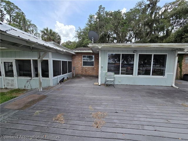 2068 Oak Blvd, Sebring, FL 33875 - wooden deck featuring a sunroom