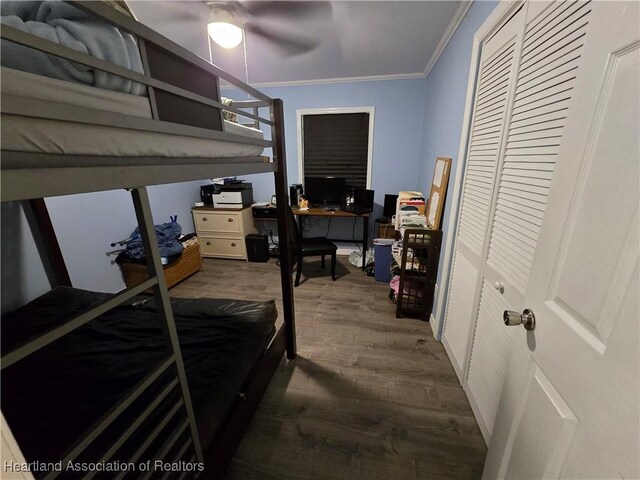 2068 Oak Blvd, Sebring, FL 33875 - bedroom with ornamental molding, dark wood finished floors, an office area, and ceiling fan