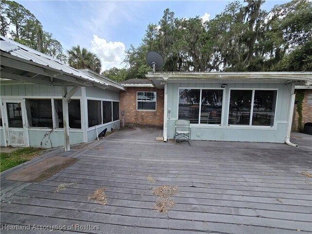 2068 Oak Blvd, Sebring, FL 33875 - wooden deck featuring a sunroom