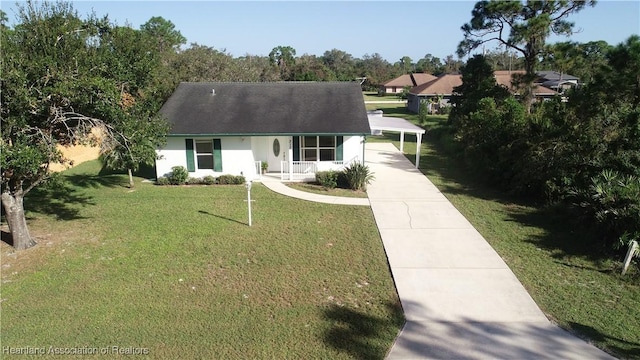 view of front facade featuring a carport and a front yard