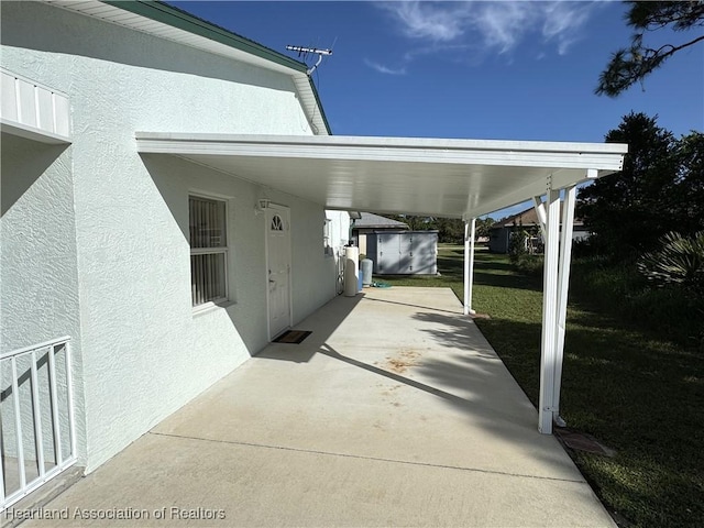 view of patio featuring a carport