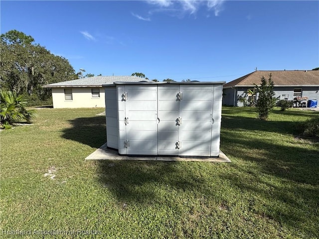 view of outdoor structure featuring a yard