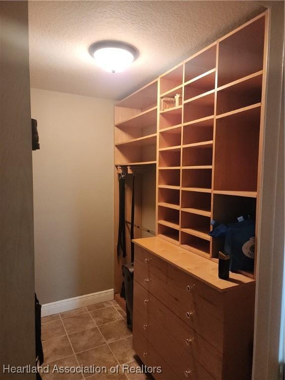 walk in closet featuring tile patterned floors