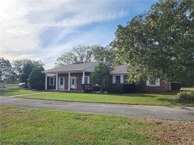 view of front of home with a front lawn