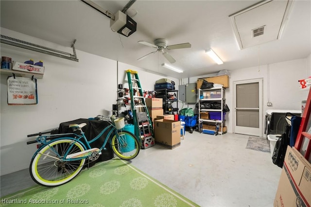 garage with visible vents, a garage door opener, and ceiling fan