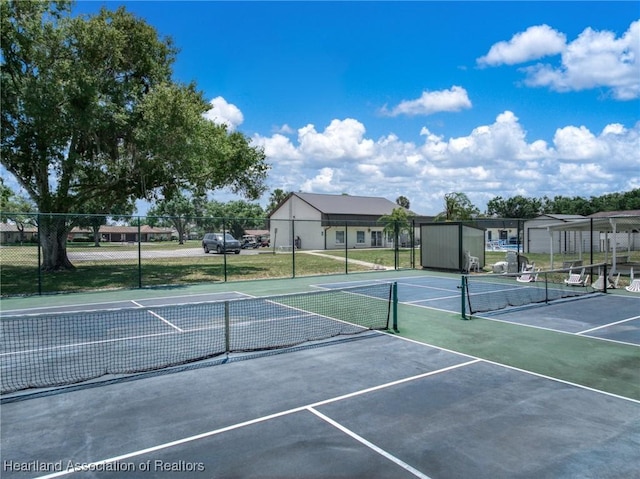 view of sport court featuring fence and community basketball court