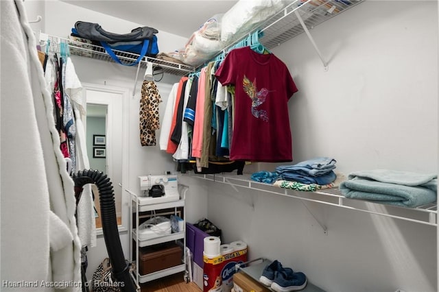 spacious closet with wood finished floors