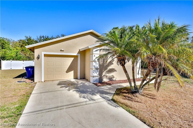 view of front facade featuring a front yard and a garage