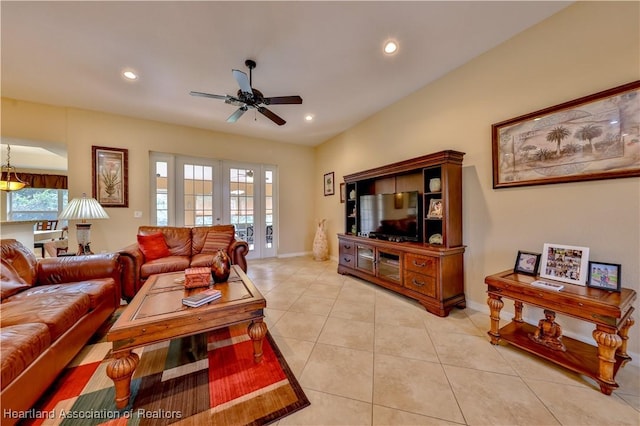 living room featuring ceiling fan, light tile patterned flooring, and french doors