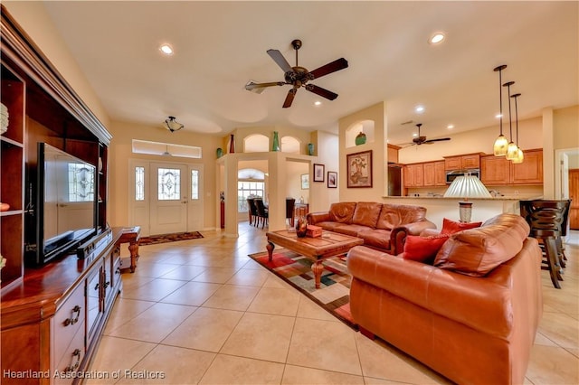 living room featuring ceiling fan and light tile patterned flooring