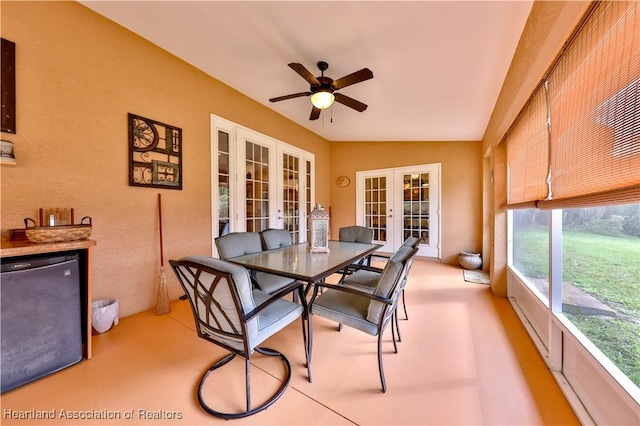 sunroom featuring ceiling fan, french doors, and vaulted ceiling