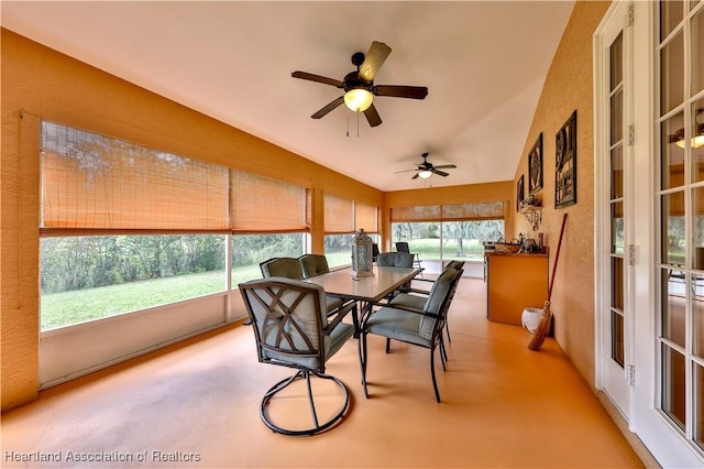 sunroom with a wealth of natural light and ceiling fan