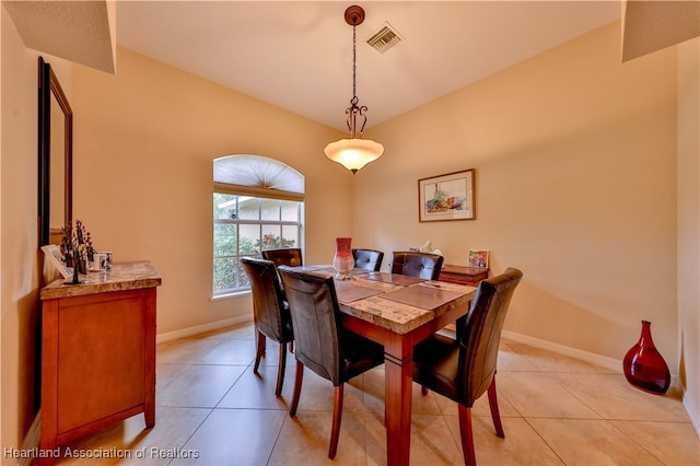 dining area featuring light tile patterned flooring