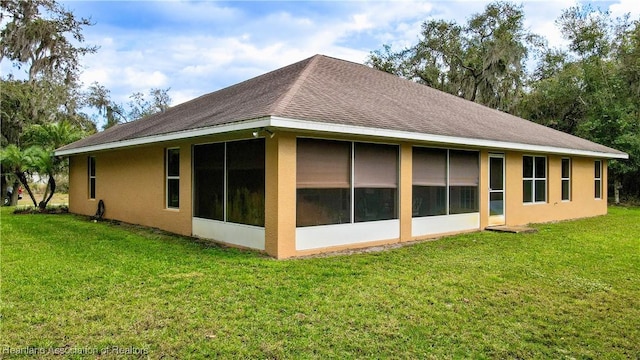 view of property exterior with a lawn