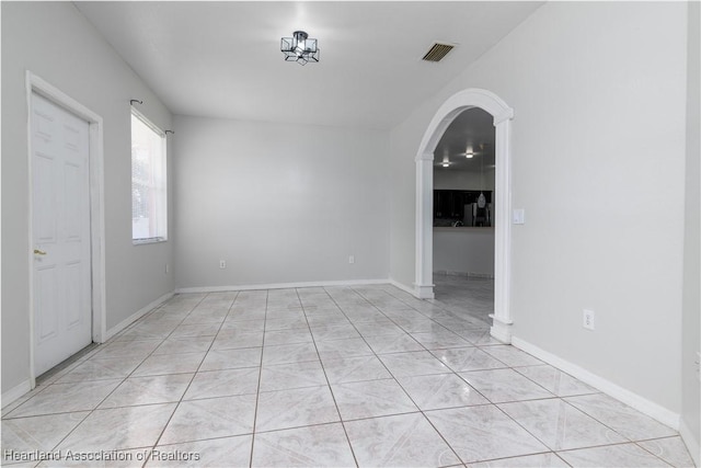 empty room with light tile patterned floors