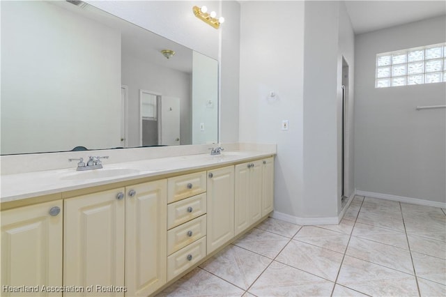 bathroom featuring tile patterned floors, vanity, and walk in shower