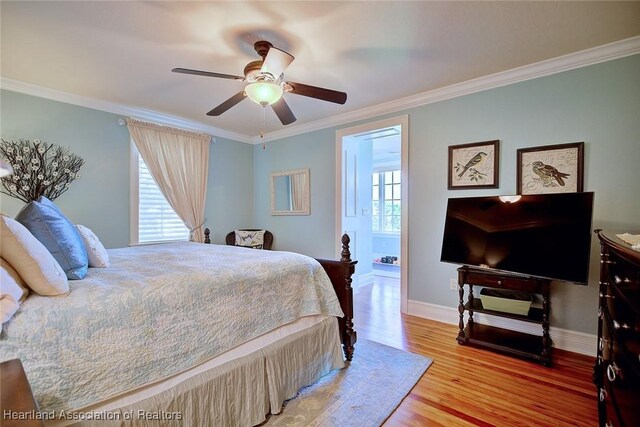 1831 Lakeview Dr, Sebring, FL 33870 - bedroom featuring ornamental molding, wood finished floors, baseboards, and ceiling fan