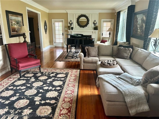 1831 Lakeview Dr, Sebring, FL 33870 - living room featuring healthy amount of natural light, wood finished floors, a fireplace, crown molding, and baseboards