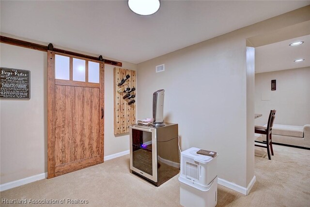 1831 Lakeview Dr, Sebring, FL 33870 - carpeted entrance foyer with baseboards, a barn door, and recessed lighting