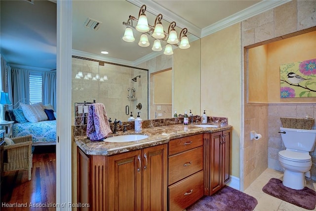 1831 Lakeview Dr, Sebring, FL 33870 - full bathroom featuring ornamental molding, connected bathroom, double vanity, a shower stall, and toilet