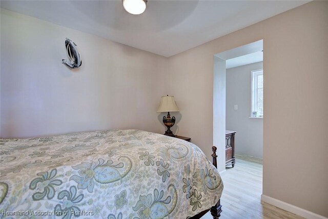 1831 Lakeview Dr, Sebring, FL 33870 - bedroom with light wood-style floors, baseboards, and a ceiling fan