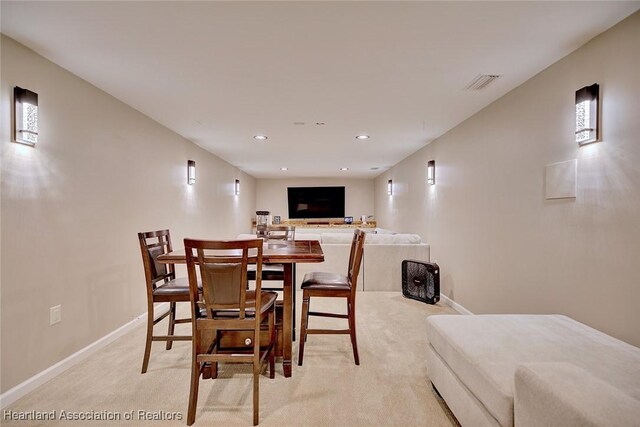 1831 Lakeview Dr, Sebring, FL 33870 - dining area featuring light colored carpet, baseboards, and recessed lighting