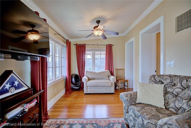 1831 Lakeview Dr, Sebring, FL 33870 - living room with a ceiling fan, crown molding, light wood-type flooring, and baseboards