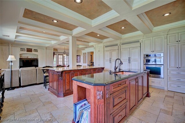 1831 Lakeview Dr, Sebring, FL 33870 - kitchen with a sink, a large island, stone tile floors, open floor plan, and coffered ceiling