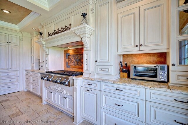 1831 Lakeview Dr, Sebring, FL 33870 - kitchen featuring stainless steel gas stovetop, backsplash, ornamental molding, light stone counters, and recessed lighting
