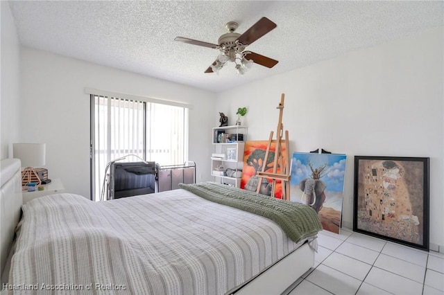 18210 Mediterranean Blvd Unit 5-20, Hialeah, FL 33015 - tiled bedroom with a textured ceiling and a ceiling fan